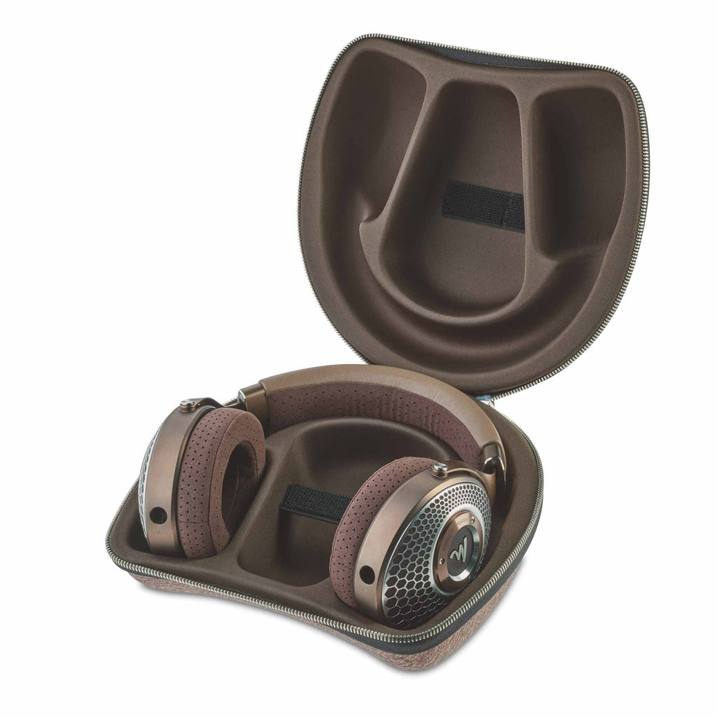 Focal Clear MG Open-Back Headphone resting in a custom brown protective carrying case with zipper open