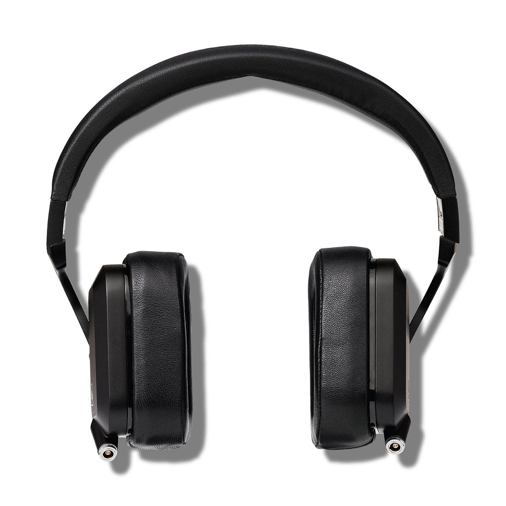Top view of Campfire Cascade closed back headphones with black leather ear pads and metal headband on white background