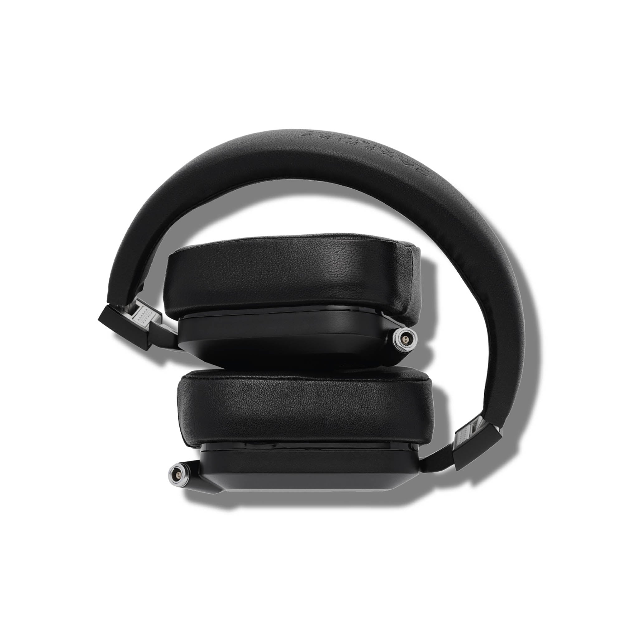 Folded Campfire Cascade closed back headphones with black leather ear pads and headband on white background