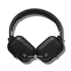 Top view of Campfire Cascade closed-back headphones with black aluminum and stainless steel chassis on white background