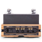 Rear view of Feliks Audio Envy Tube Headphone Amplifier showing power input and audio connectors on wooden base.
