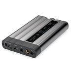 iFi Audio xDSD Gryphon Portable DAC/Amp showing digital display and multiple audio input and output ports on gray surface