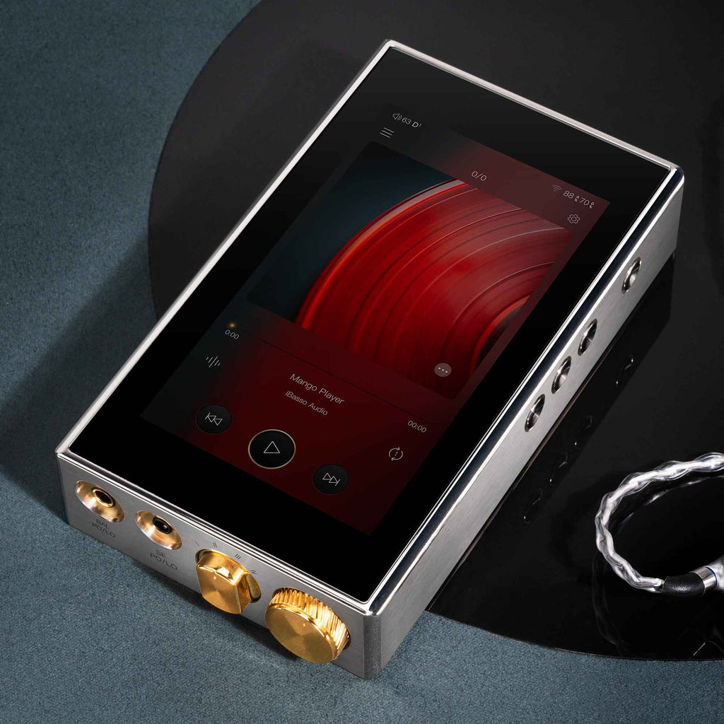 iBasso DX320MAX Ti Flagship Digital Audio Player with touchscreen and gold volume knob on a dark surface next to cable