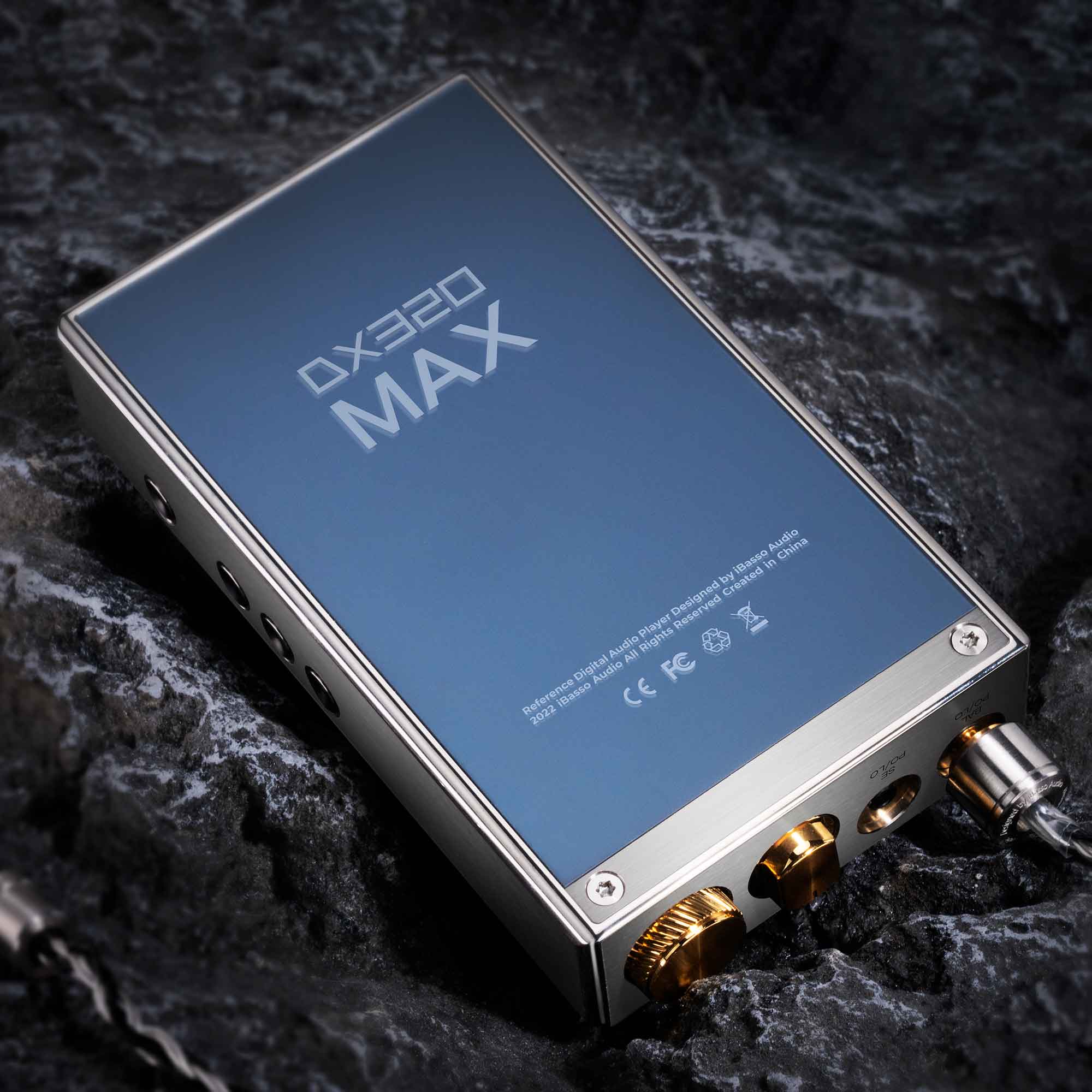 iBasso DX320MAX Ti Flagship Digital Audio Player resting on dark textured surface angled to show top and side controls