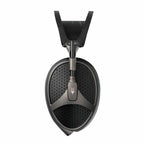 Close-up of the Meze Elite open back planar magnetic headphone ear cup with textured grille design on white background