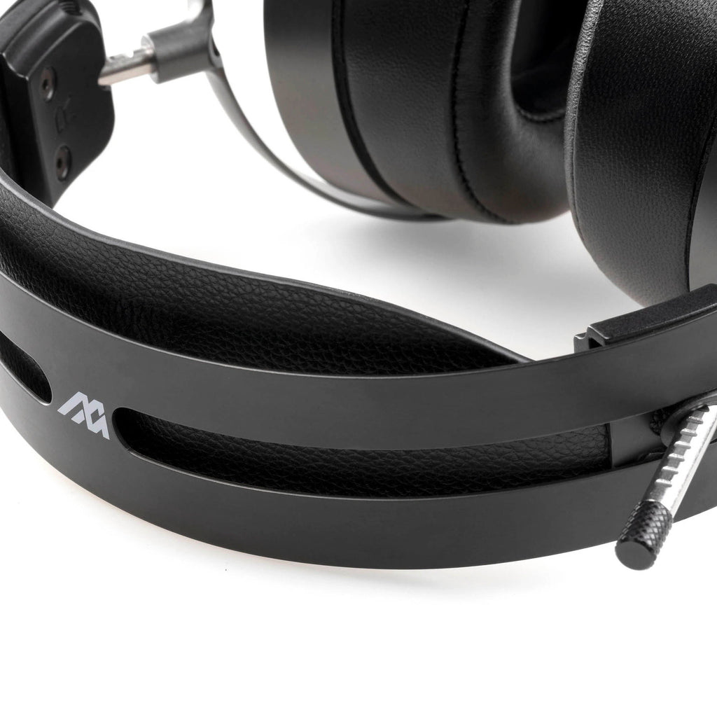 Close-up of the Audeze MM-500 headphones showing black headband and padded ear cups on a white background