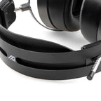 Close-up of the Audeze MM-500 headphones showing black headband and padded ear cups on a white background