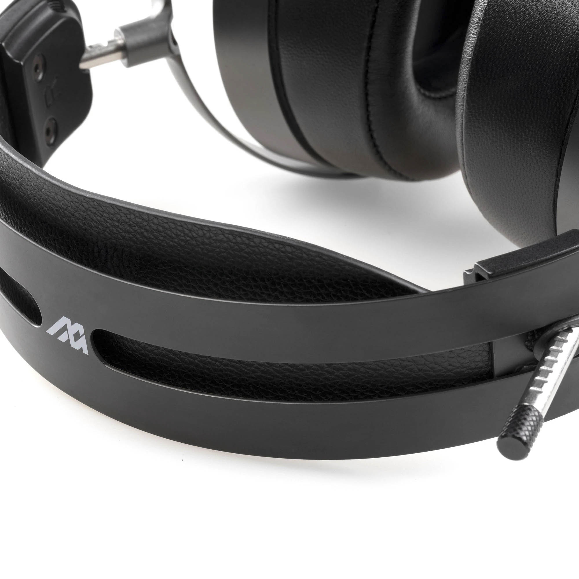 Close-up of the Audeze MM-500 headphones showing black headband and padded ear cups on a white background