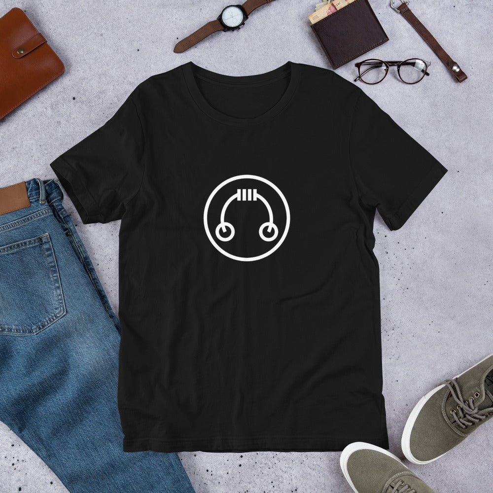 Flat lay of black HeadAmp Logo T-Shirt with white design, paired with blue jeans, watch, glasses, wallet, and shoes on gray background