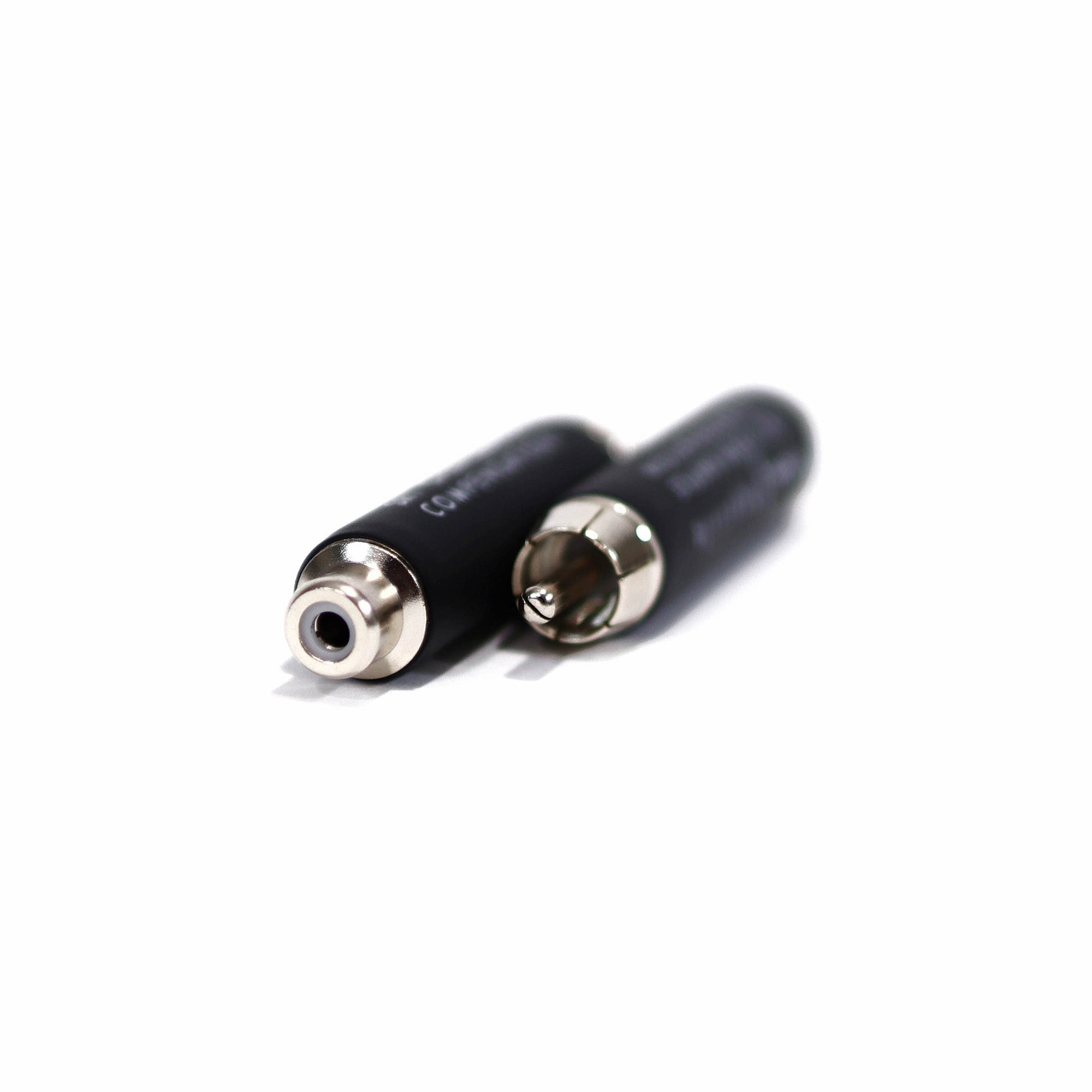 Close-up of RAAL-requisite Open-Baffle Compensation Barrels for SR1 showing black cylindrical connectors on white background