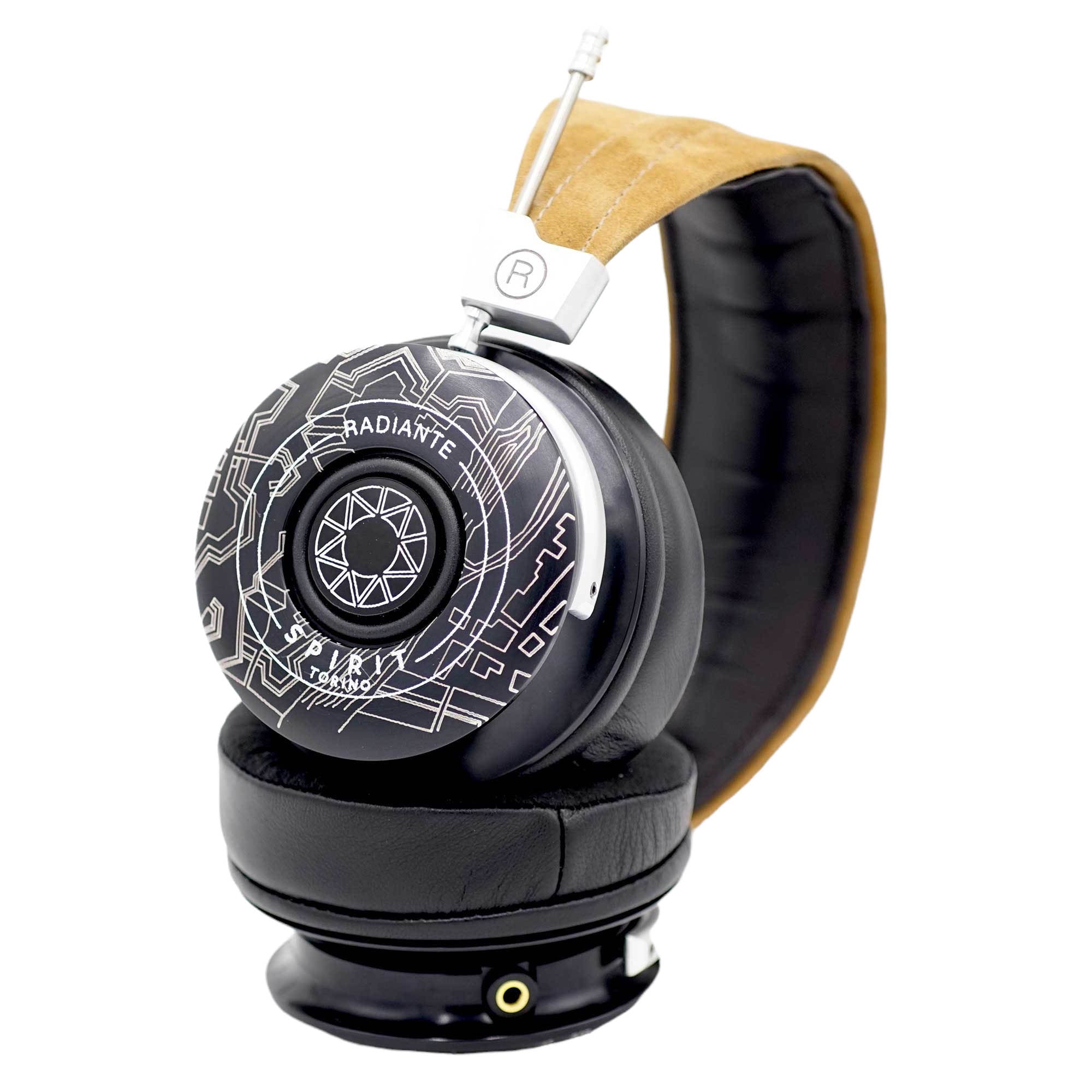 Spirit Torino Radiante Closed-Back (Pre-Owned) headphone with black ear cups, geometric design, and tan headband on white background