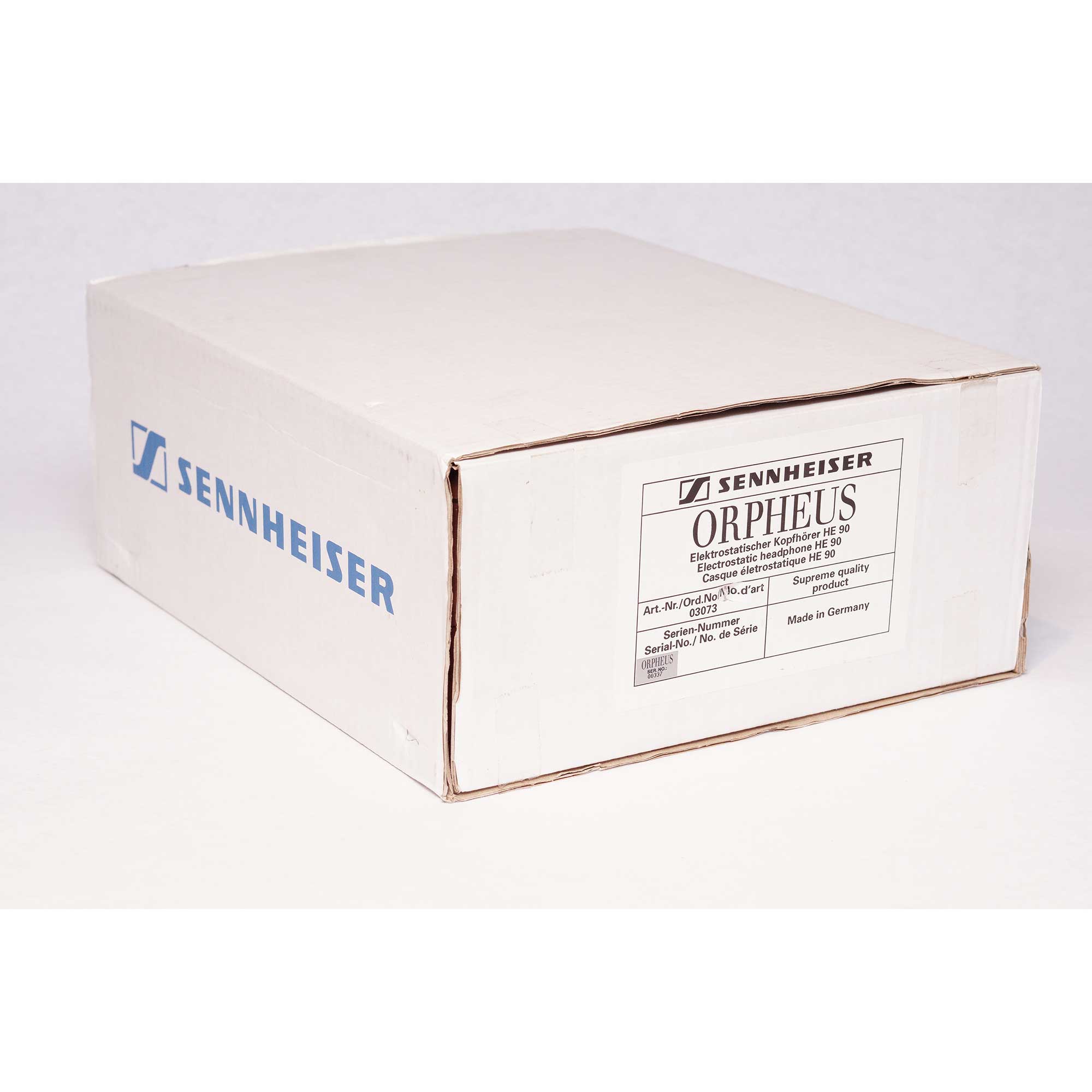 White shipping box with Sennheiser Orpheus HE90 / HEV90 branding and product information on a plain white background