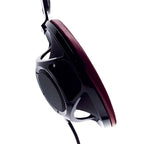 Close-up side view of Sony Qualia 010 Reference Headphone with burgundy ear pad and black open-back design on white background