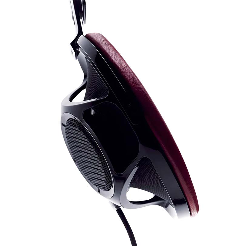 Close-up side view of Sony Qualia 010 Reference Headphone with burgundy ear pad and black open-back design on white background