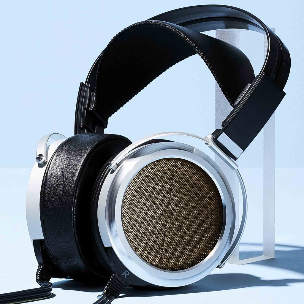 STAX SR-009S Open-Back Electrostatic Headphones with leather headband and silver ear cups on a light background