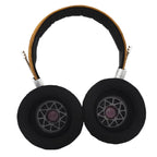 Top-down view of Spirit Torino Super Leggera 1706 open back headphones with black ear pads and leather headband