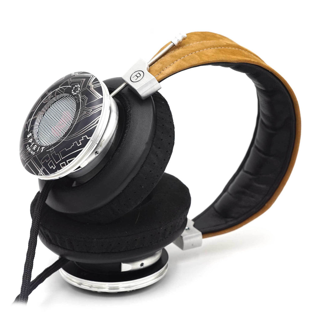 Close-up of Spirit Torino Twin Pulse 1706 open back headphones with black ear pads and tan headband on white background