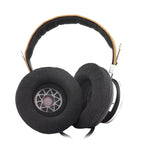 Spirit Torino Twin Pulse open back dynamic headphones with black ear pads and silver and tan headband on white background