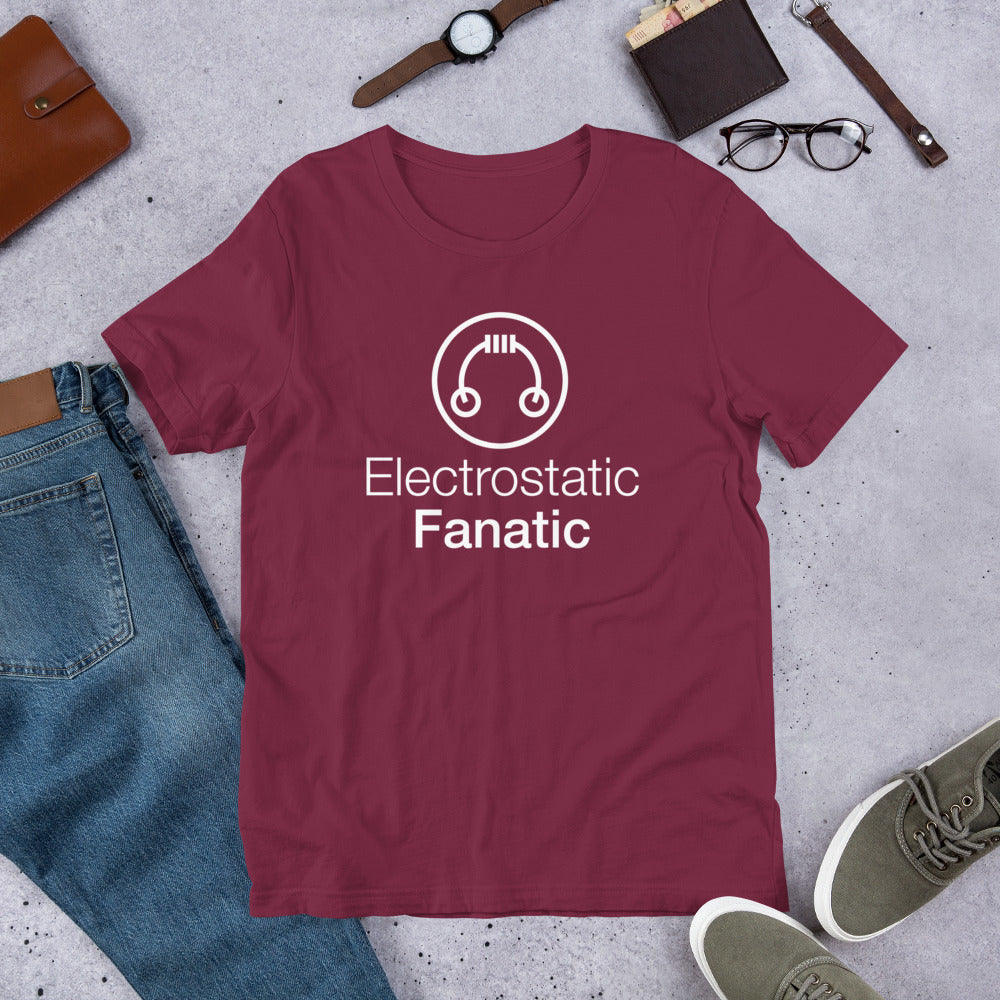 Top view of maroon HeadAmp Electrostatic Fanatic T-Shirt with white logo laid flat with casual accessories nearby