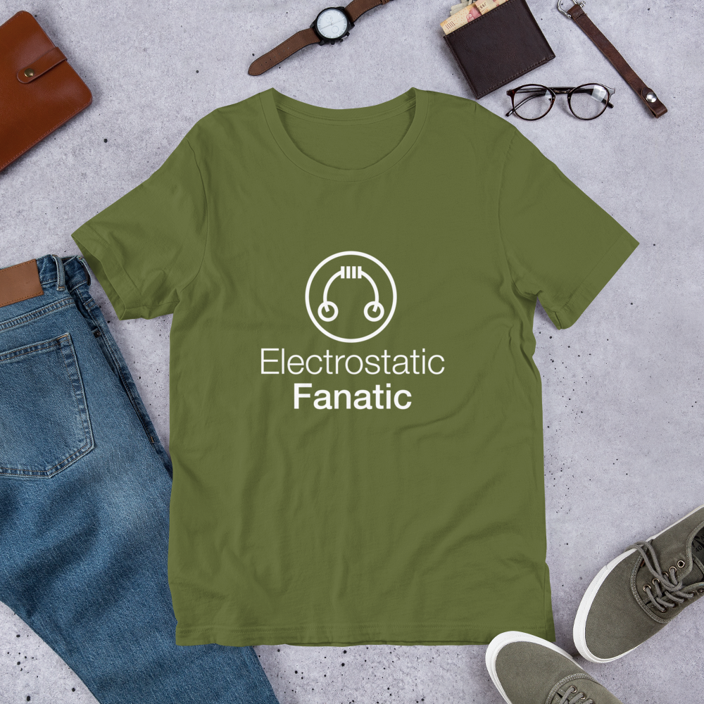 HeadAmp Electrostatic Fanatic T-Shirt in olive green with white text and graphic laid flat with casual accessories nearby