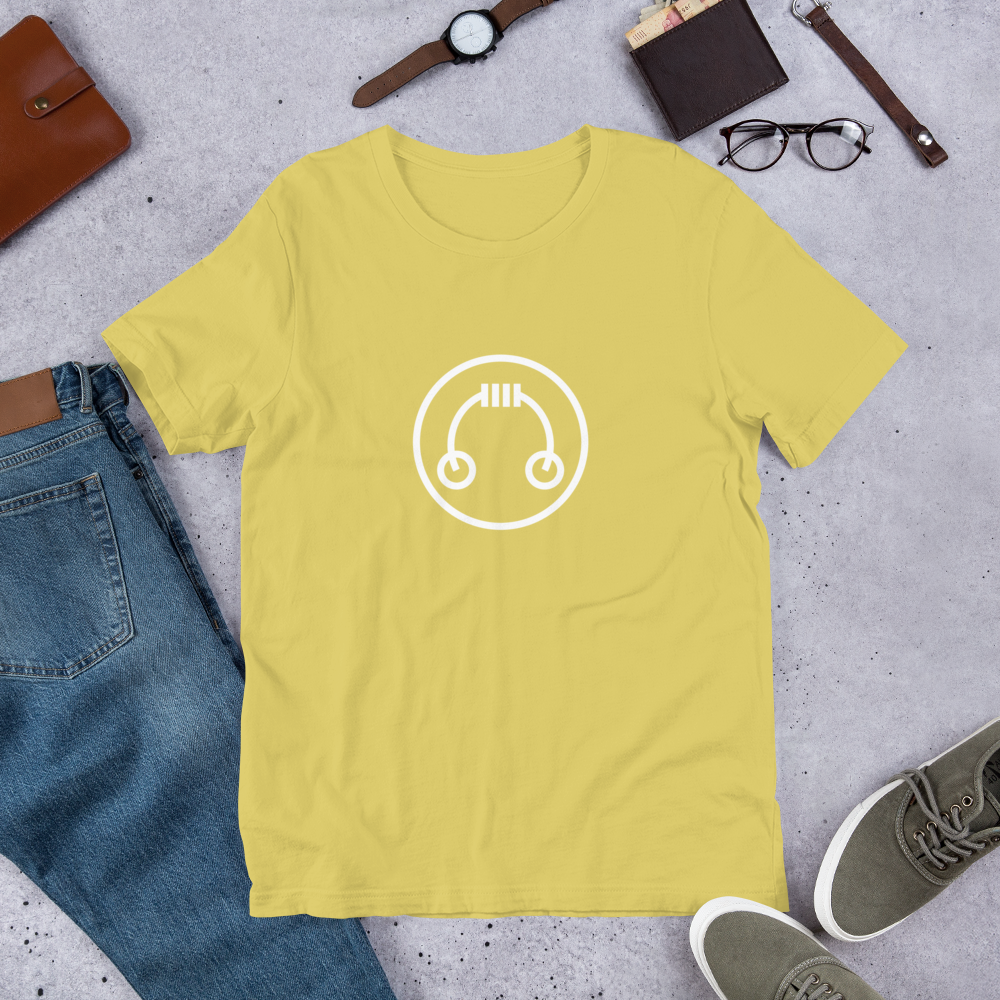 HeadAmp Logo T-Shirt in soft yellow with white circular logo, displayed flat with casual accessories on gray background