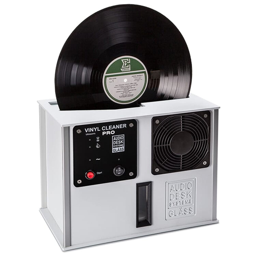 Audio Desk Vinyl Cleaner Pro X with black vinyl record inserted, white casing, control panel, and cooling fan visible