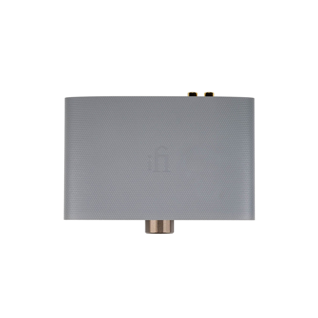 Top view of the gray iFi Audio ZEN Air DAC with textured surface and visible gold-plated connectors on white background
